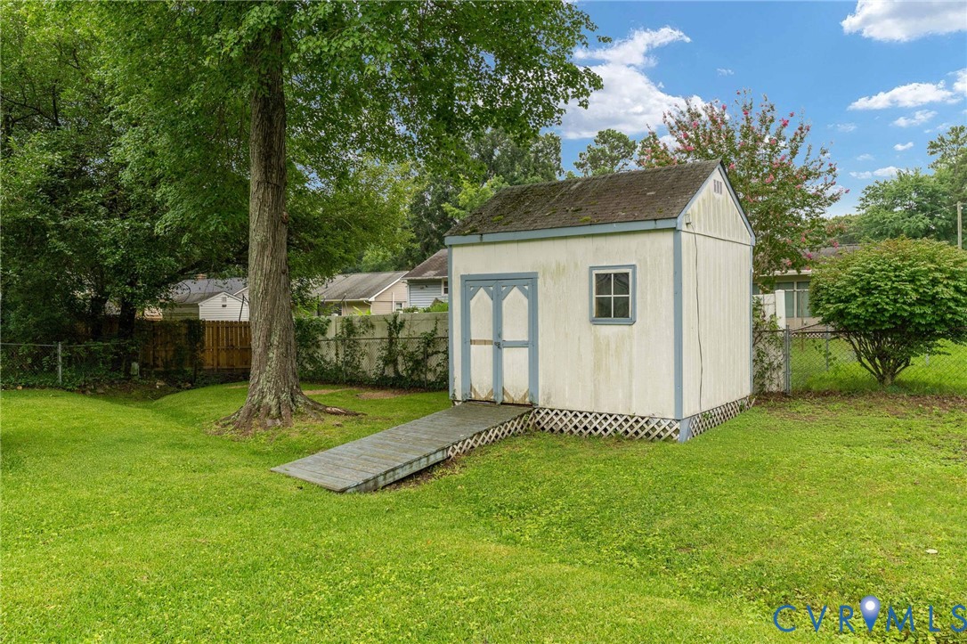 5927 Swanson Road Richmond, VA 23225 - Photo 21 of 23 Detached storage shed with a gable roof, single wi