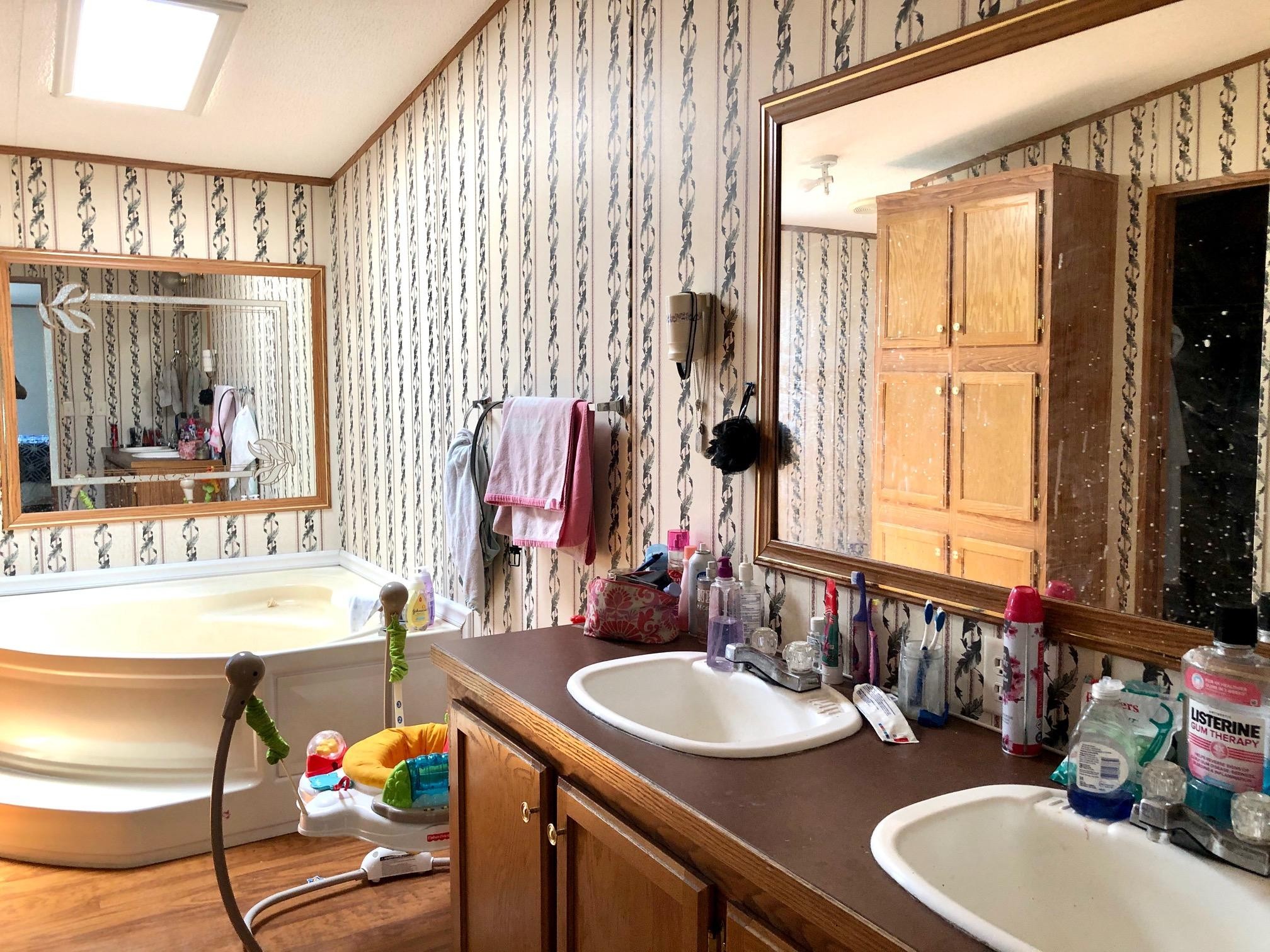 136 Mountain Road Blaine, TN 37709 - Photo 16 of 21 a bathroom with a sink double vanity and a mirror