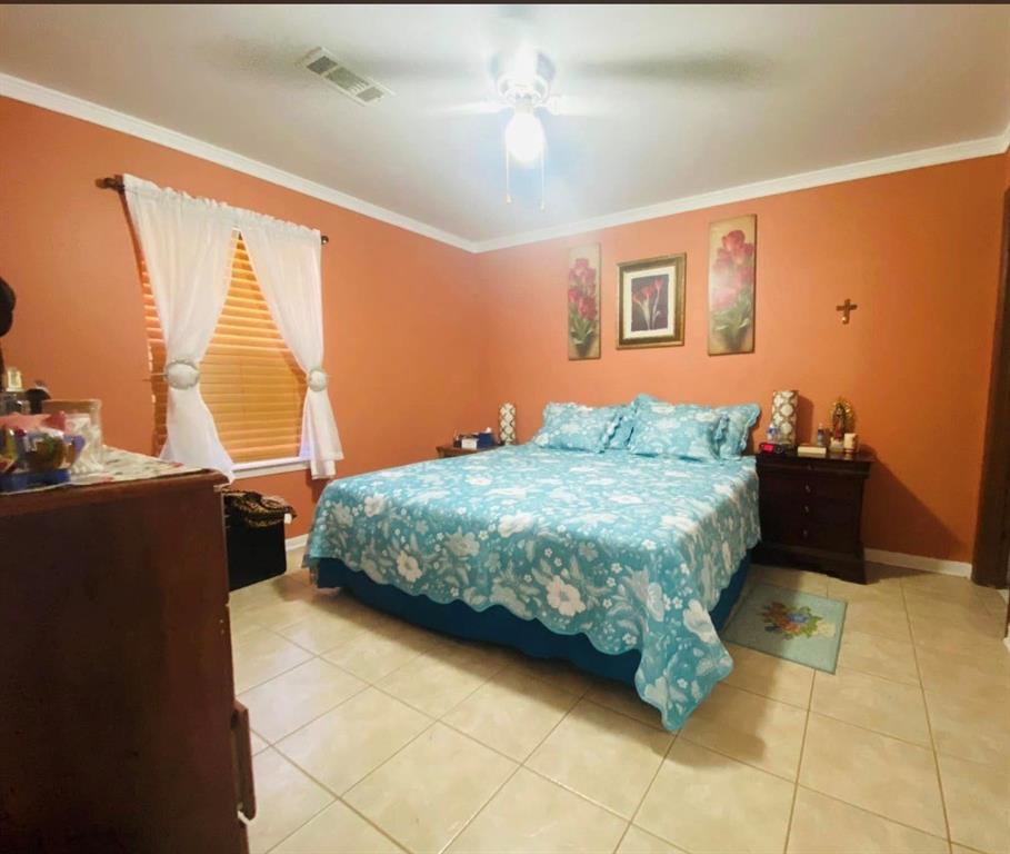 504 Wilson Road Bellmead, TX 76705 - Photo 3 of 12 a bedroom with a bed and a window