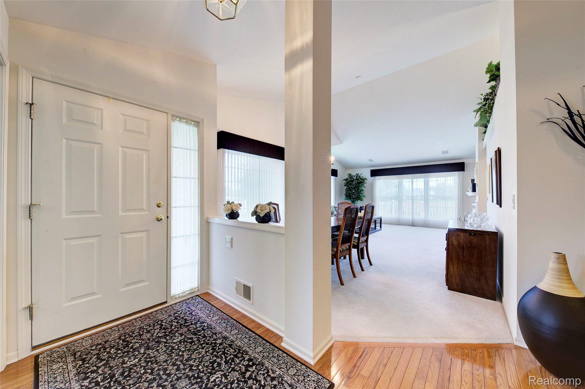 2577 Cleveland Way Canton, MI 48188 - Photo 4 of 34 Foyer featuring light wood-style floors and light colored carpet