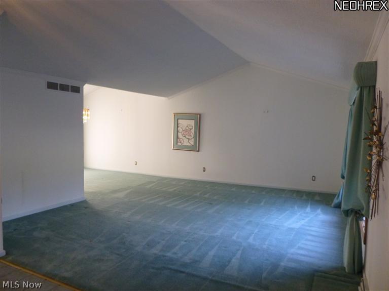 Bright and Sunny Formal Living Room with Cathedral Ceiling