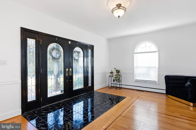 a room with furniture and wooden floor