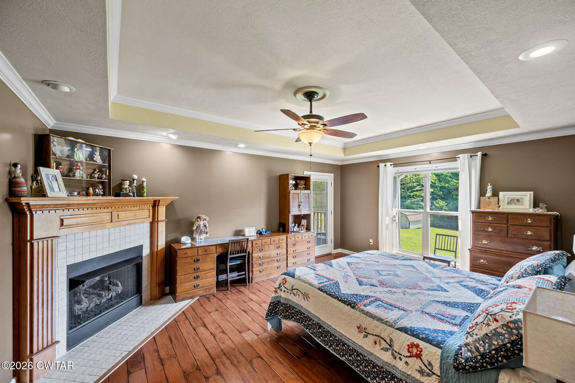 492 Joe Horton Road Lexington, TN 38351 - Photo 18 of 49 a bedroom with a bed and a fireplace