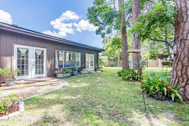 a view of empty room with wooden floor and fireplace