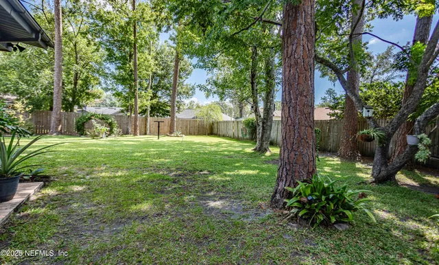 a kitchen with stainless steel appliances granite countertop a stove a microwave and a refrigerator