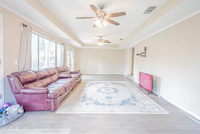a picture of a living room with a rug