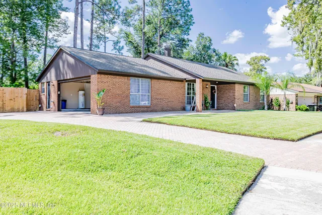 a house view with a sitting space and garden space