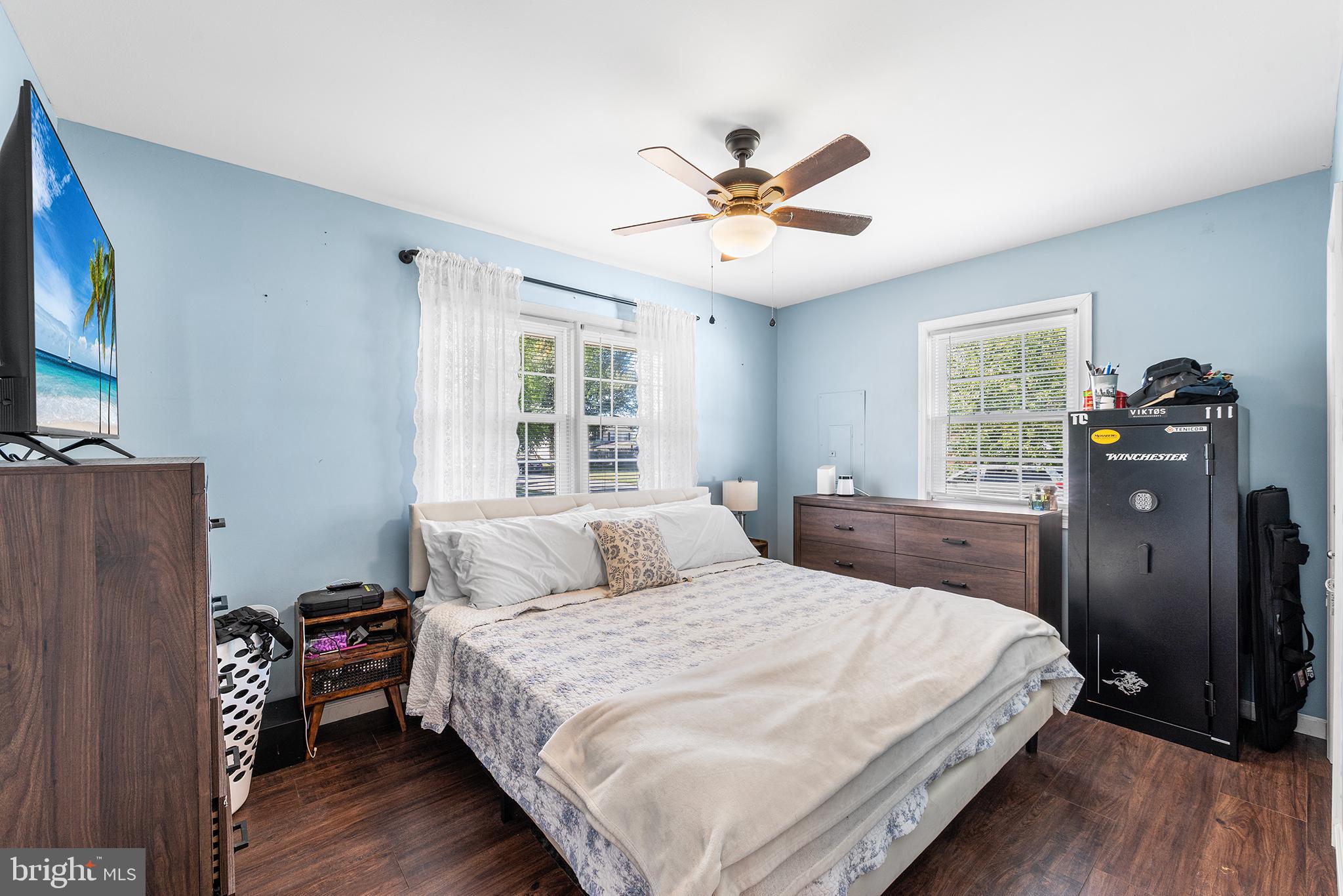 128 Michigan Road Pennsville, NJ 08070 - Photo 16 of 30 a bedroom with a bed dresser and a window