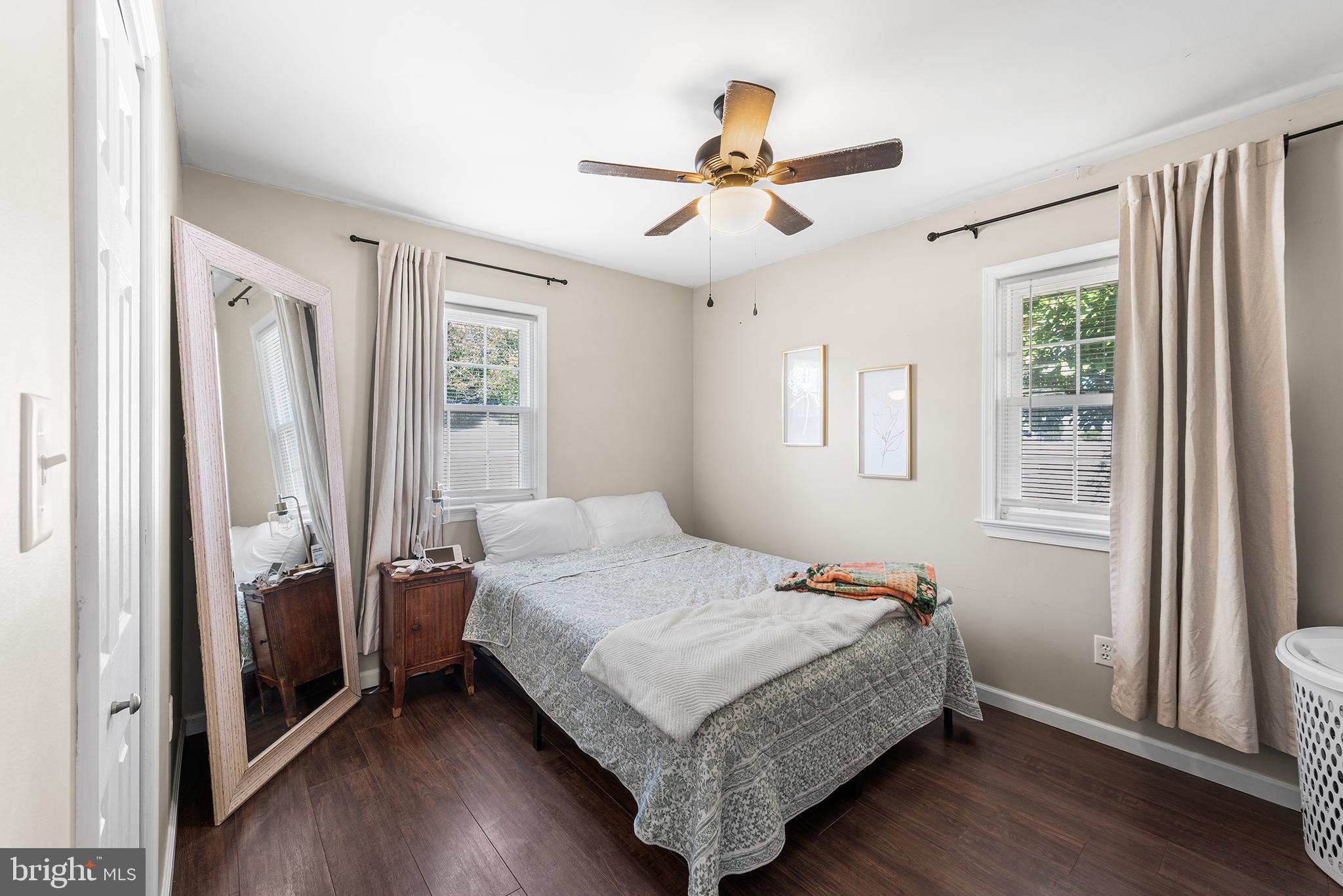 128 Michigan Road Pennsville, NJ 08070 - Photo 20 of 30 a bedroom with a bed and wooden floor