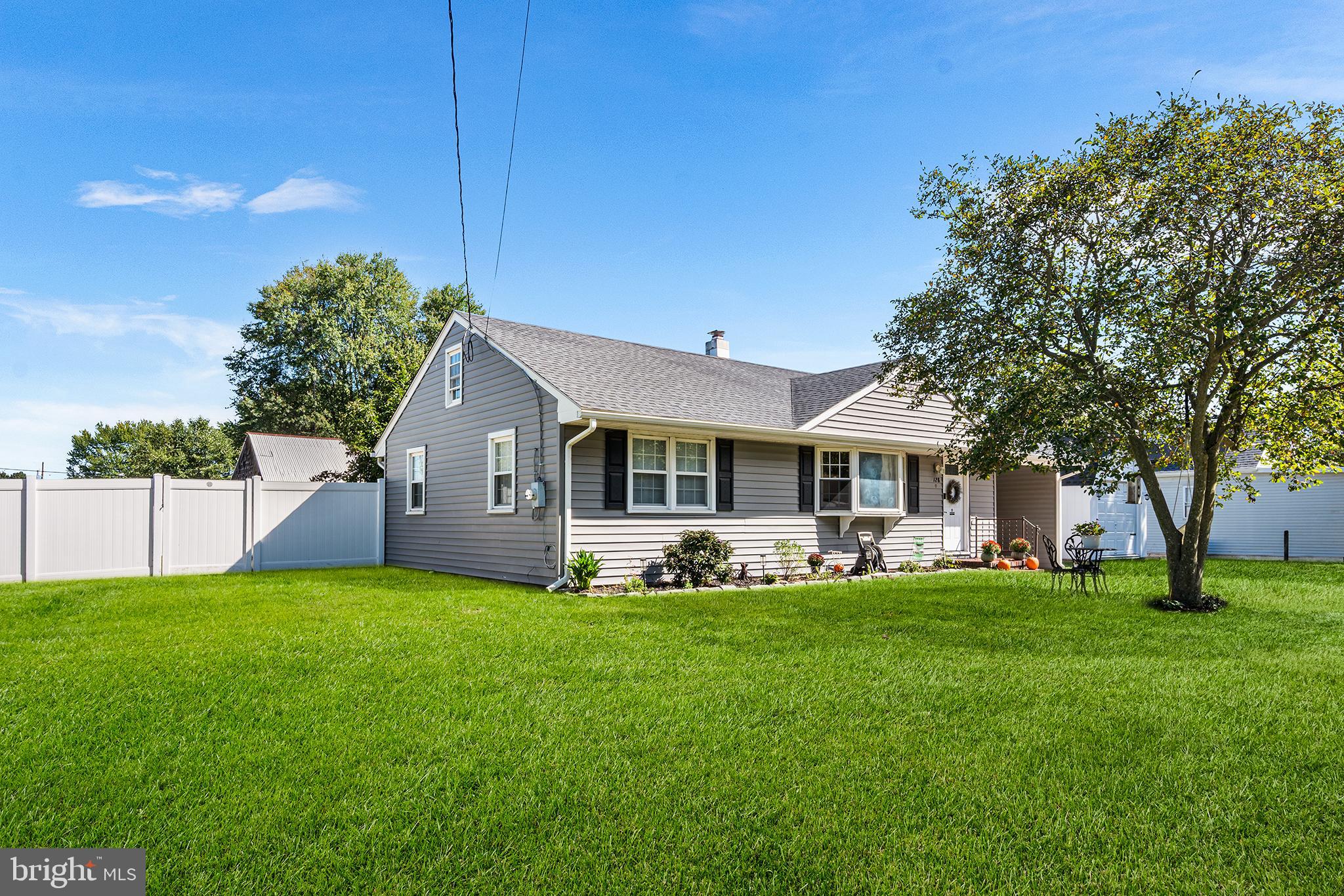 128 Michigan Road Pennsville, NJ 08070 - Photo 2 of 30 a front view of house with yard and green space