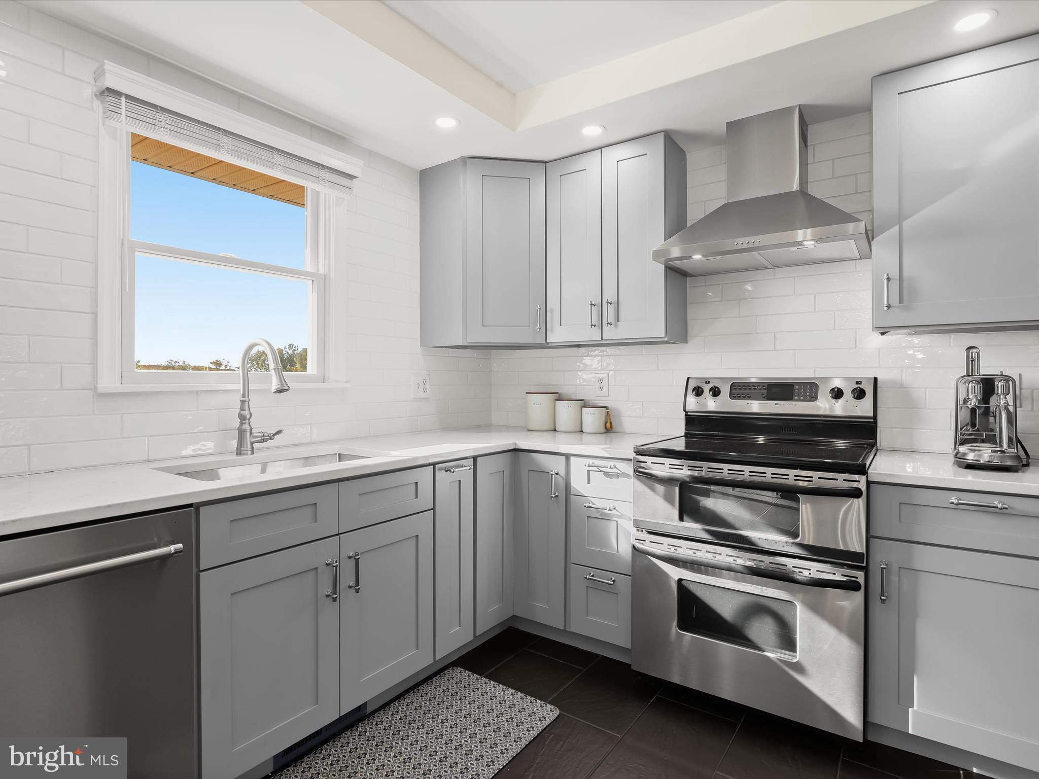 4174 Norrisville Road White Hall, MD 21161 - Photo 13 of 77 a kitchen with a stove and a sink