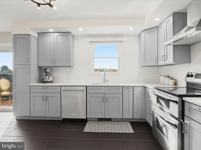 a bedroom with a large bed and a large window