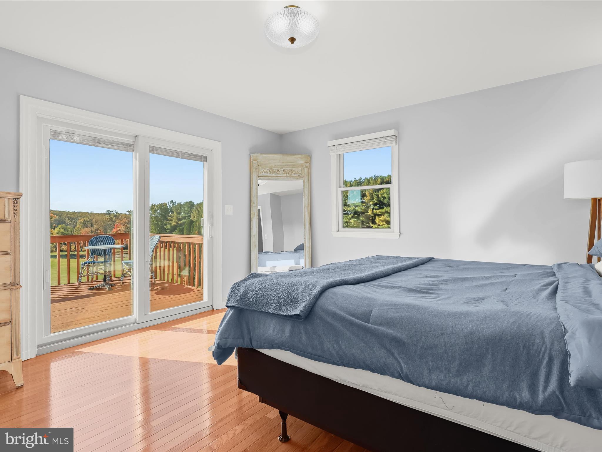 4174 Norrisville Road White Hall, MD 21161 - Photo 17 of 77 a bedroom with a large bed and a large window