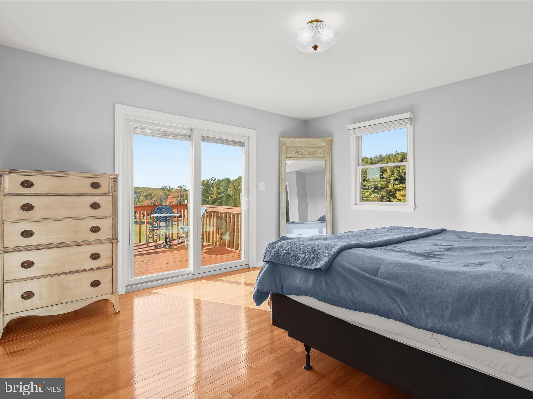 4174 Norrisville Road White Hall, MD 21161 - Photo 18 of 77 a bedroom with a bed a dresser and a window