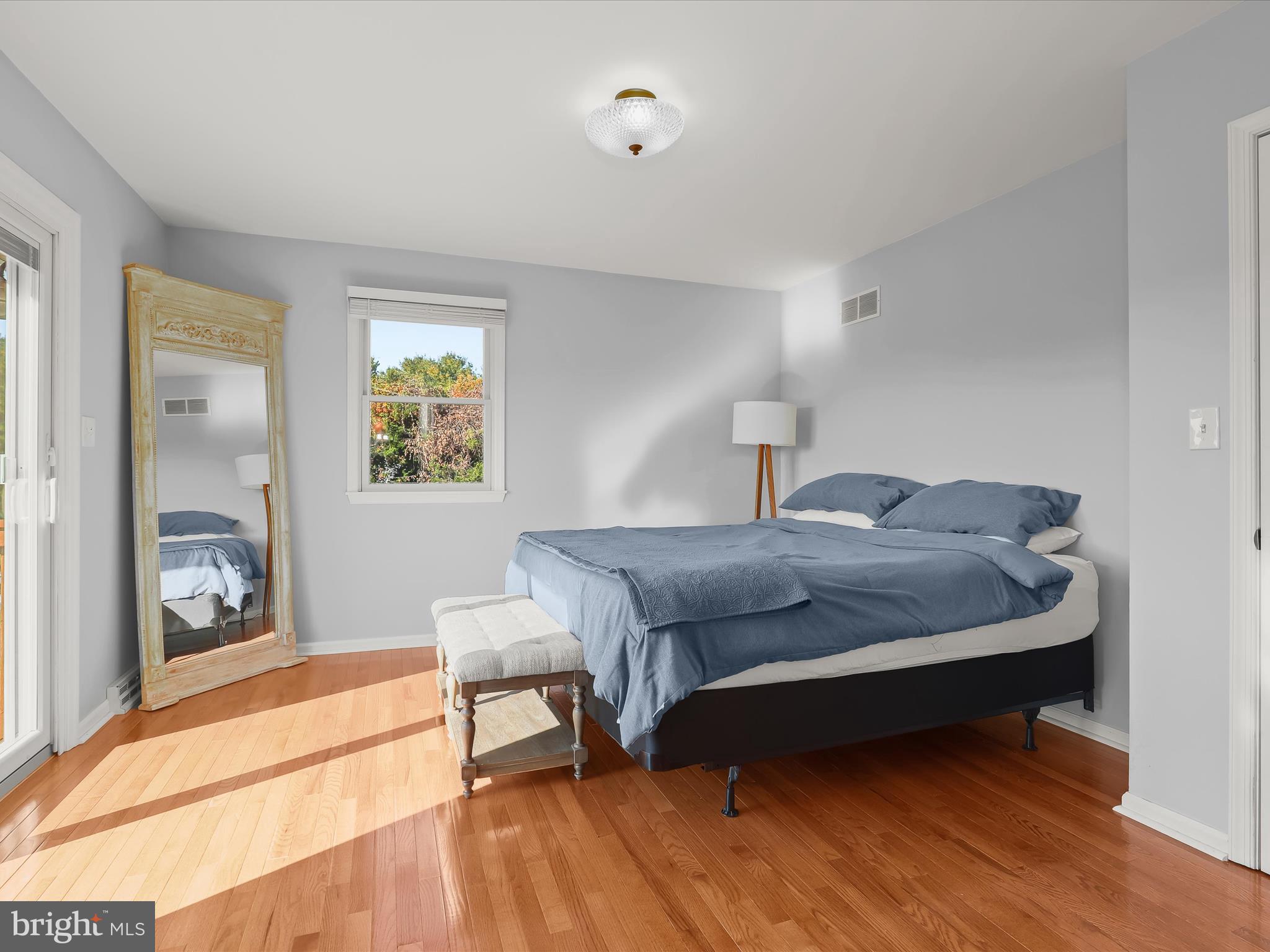 4174 Norrisville Road White Hall, MD 21161 - Photo 19 of 77 a bedroom with a bed and a dresser next to a window