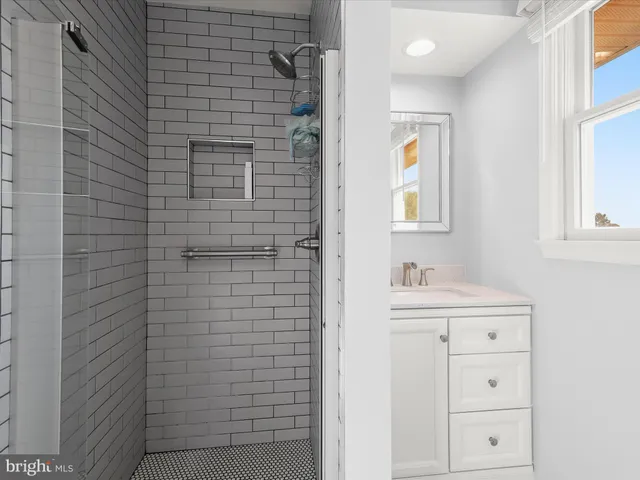 a bathroom with a shower and a toilet