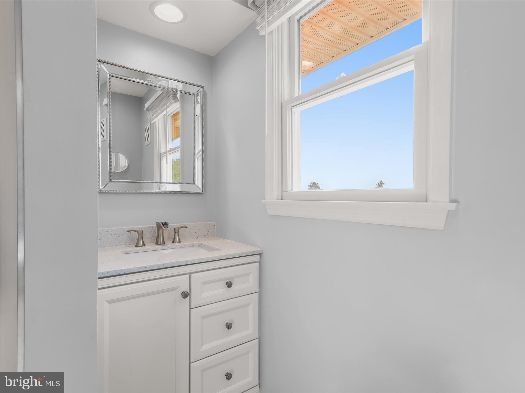 4174 Norrisville Road White Hall, MD 21161 - Photo 22 of 77 a bathroom with a sink vanity and mirror