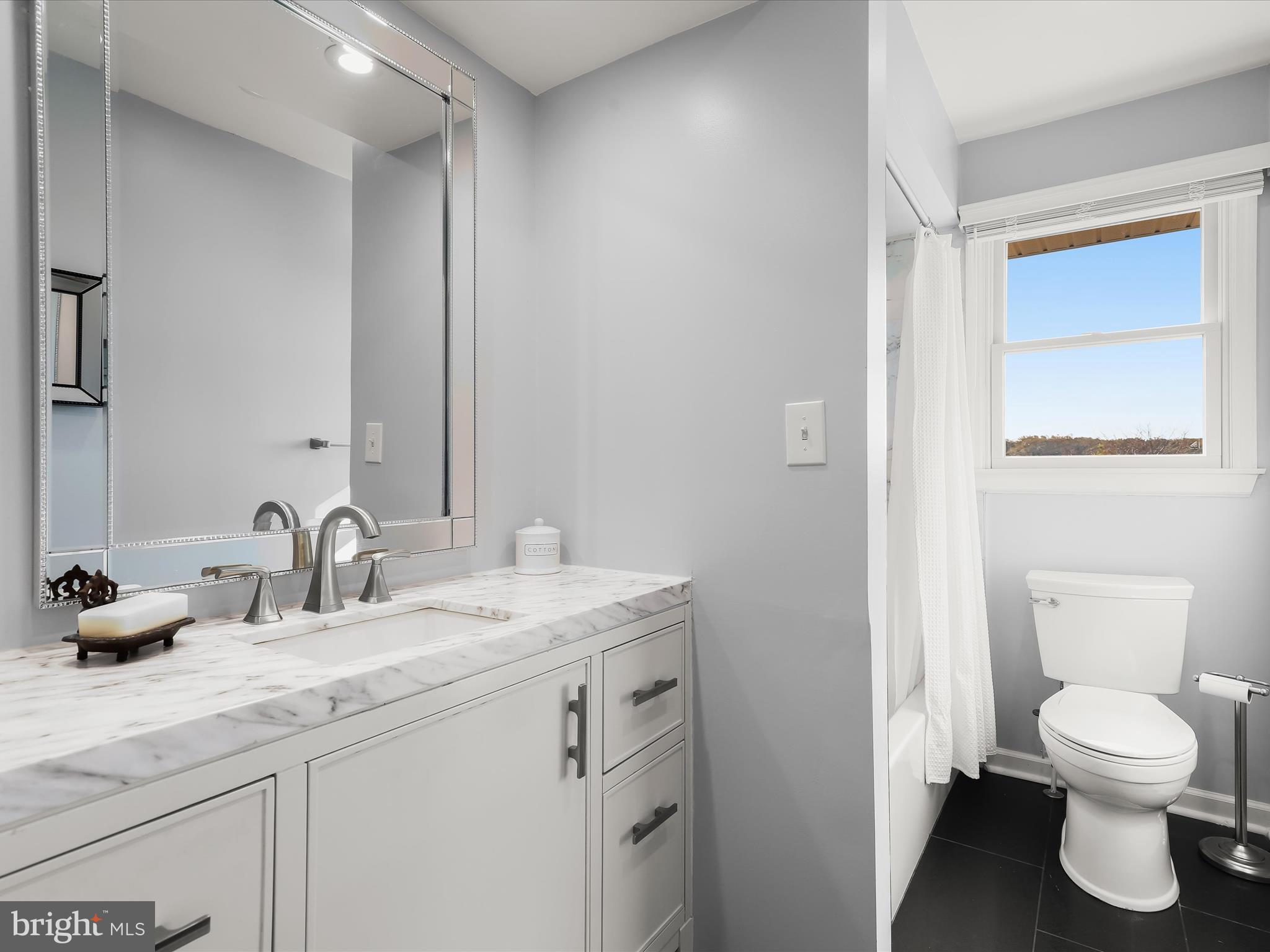 4174 Norrisville Road White Hall, MD 21161 - Photo 23 of 77 a bathroom with a granite countertop sink toilet and a mirror