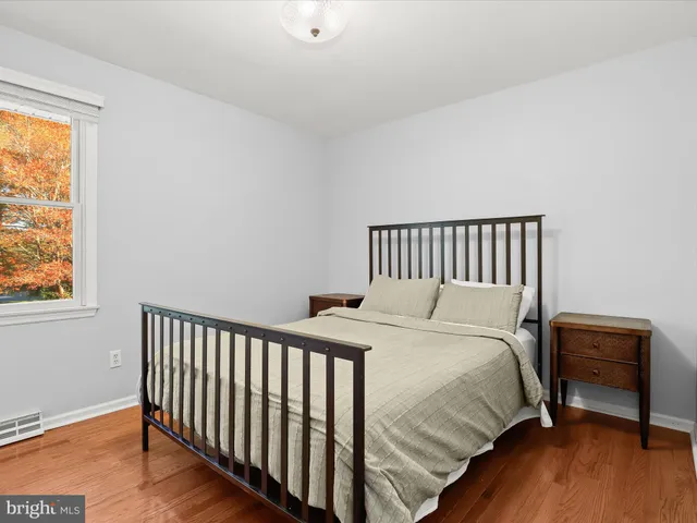 a workspace with wooden floor and a window