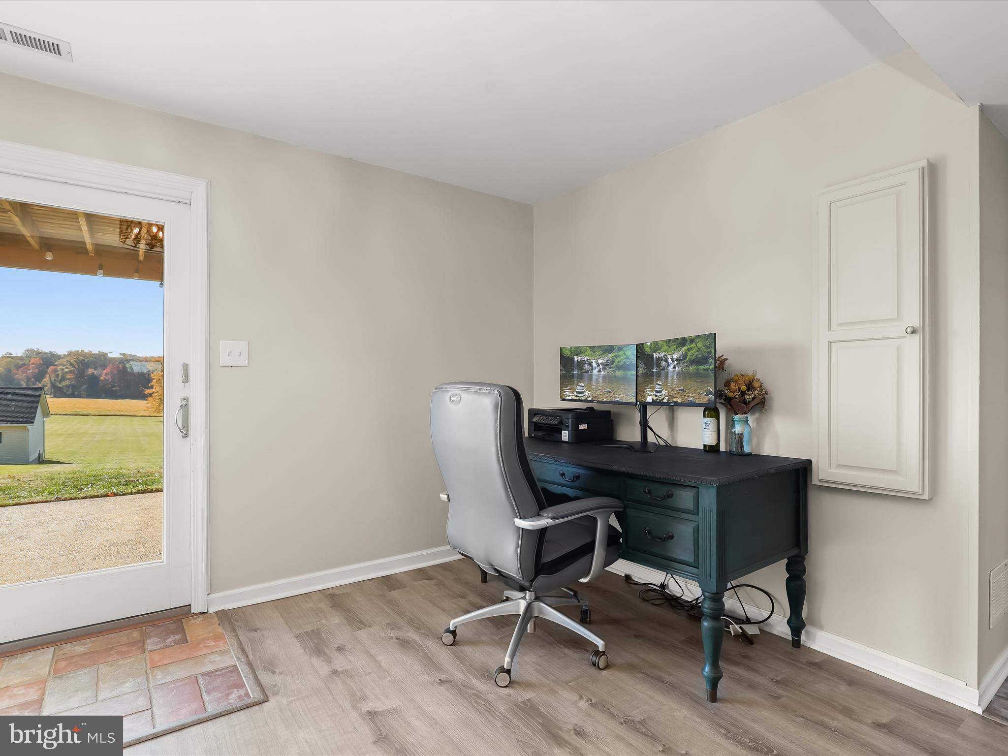 4174 Norrisville Road White Hall, MD 21161 - Photo 32 of 77 a view of a workspace with furniture and a window