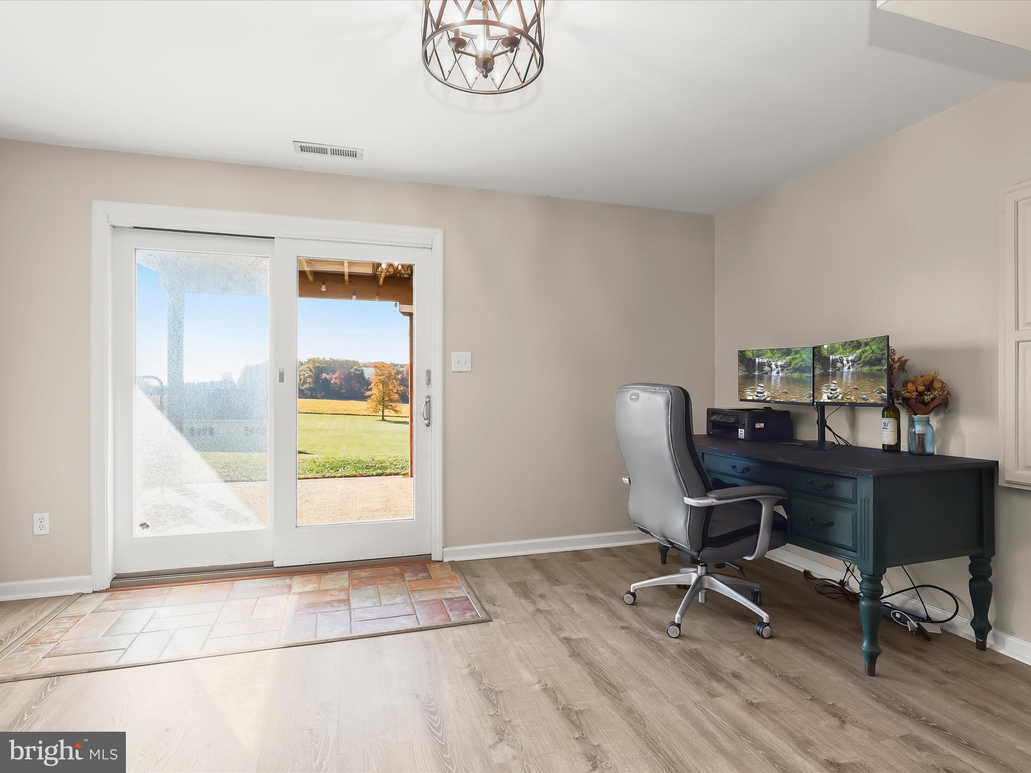 4174 Norrisville Road White Hall, MD 21161 - Photo 33 of 77 a workspace with wooden floor and a window
