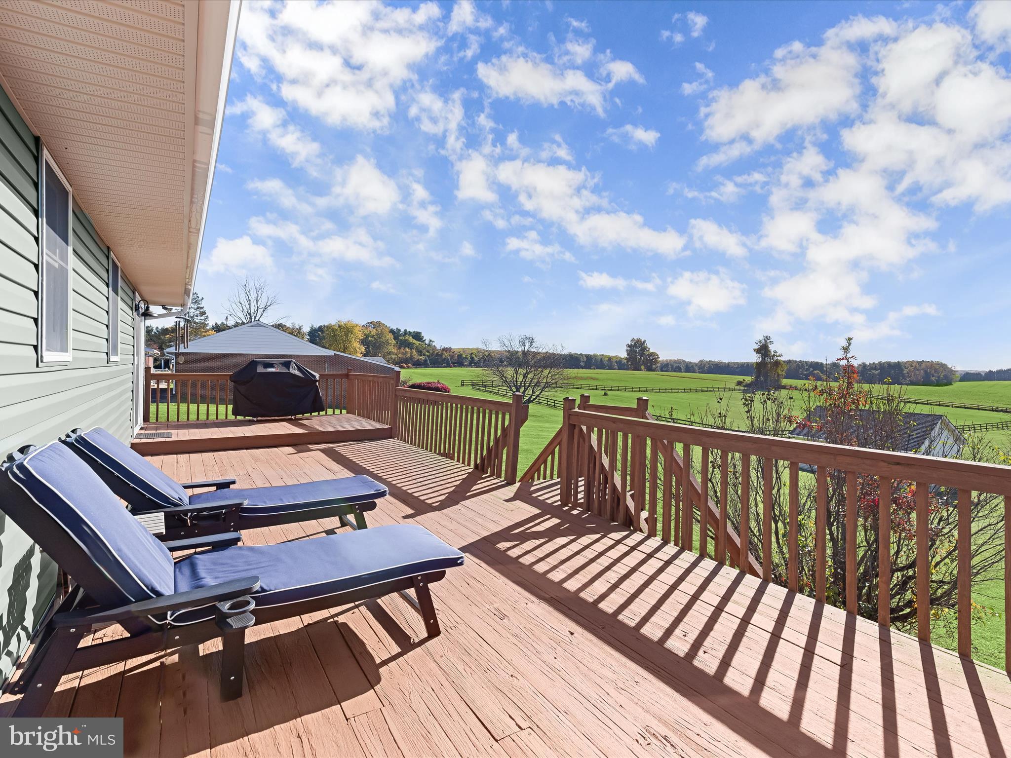 4174 Norrisville Road White Hall, MD 21161 - Photo 39 of 77 a view of a balcony with two chairs and wooden floor