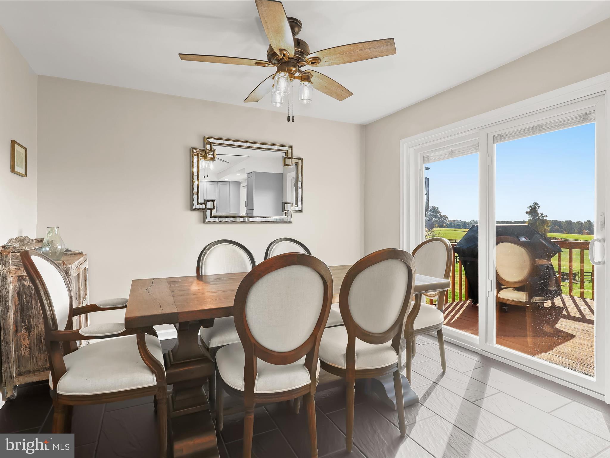 4174 Norrisville Road White Hall, MD 21161 - Photo 9 of 77 a dining room with chandelier fan and wooden floor