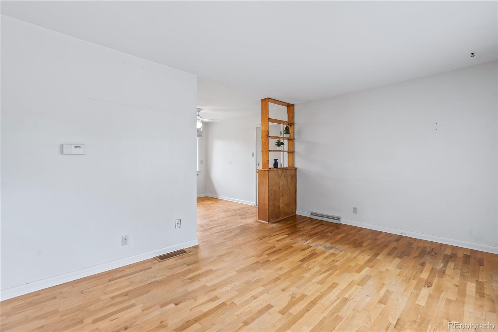 1971 Evergreen Avenue Boulder, CO 80304 - Photo 14 of 36 a view of an empty room with wooden floor