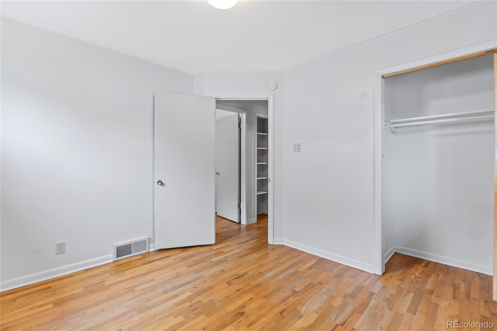 1971 Evergreen Avenue Boulder, CO 80304 - Photo 30 of 36 a view of an empty room with wooden floor and closet