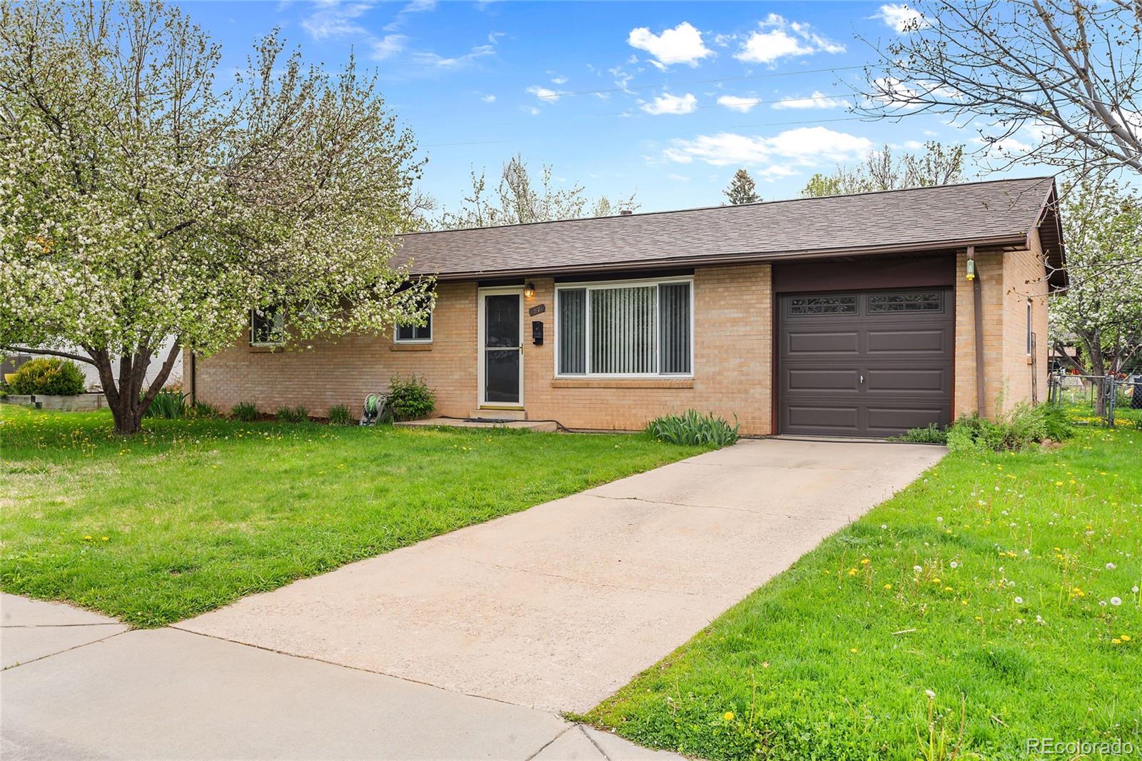 1971 Evergreen Avenue Boulder, CO 80304 - Photo 3 of 36 a front view of a house with a garden and yard