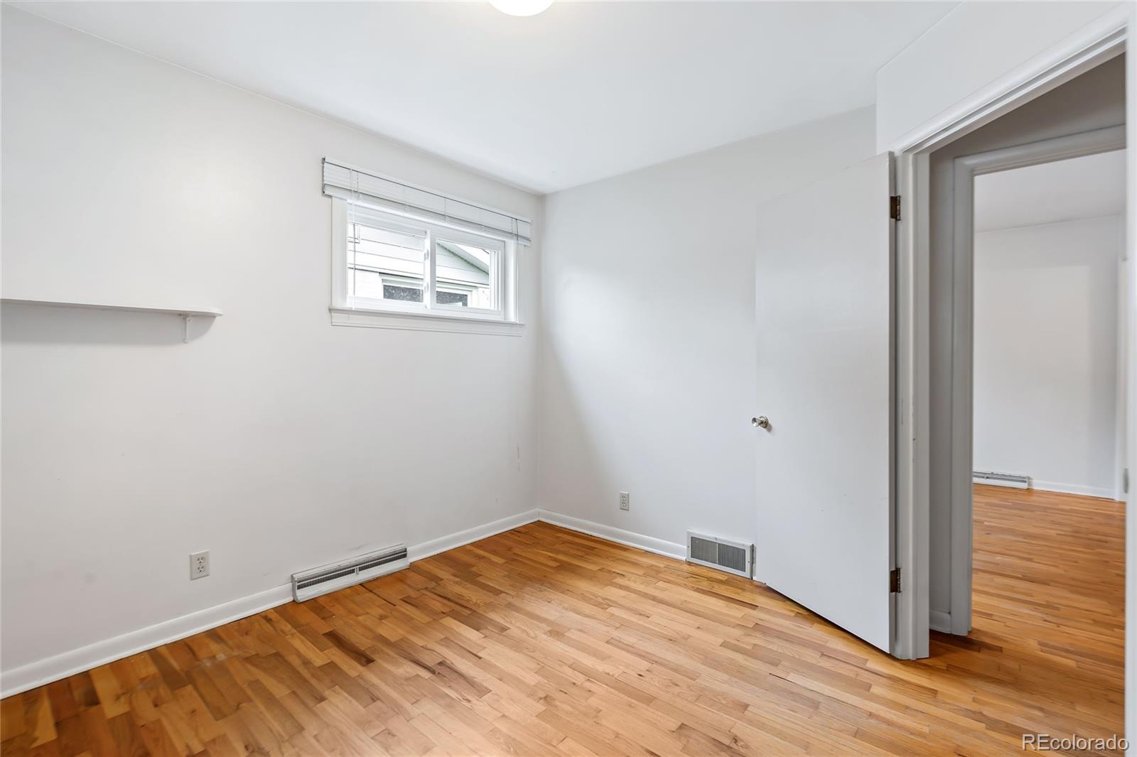 1971 Evergreen Avenue Boulder, CO 80304 - Photo 31 of 36 a view of empty room with wooden floor