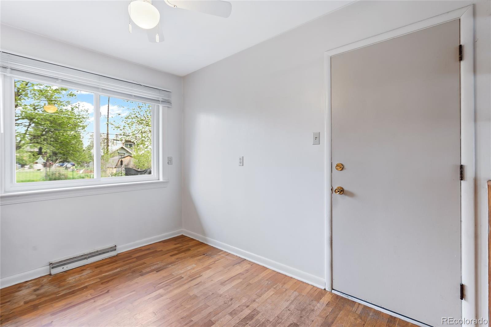 1971 Evergreen Avenue Boulder, CO 80304 - Photo 33 of 36 a view of empty room with wooden floor and fan