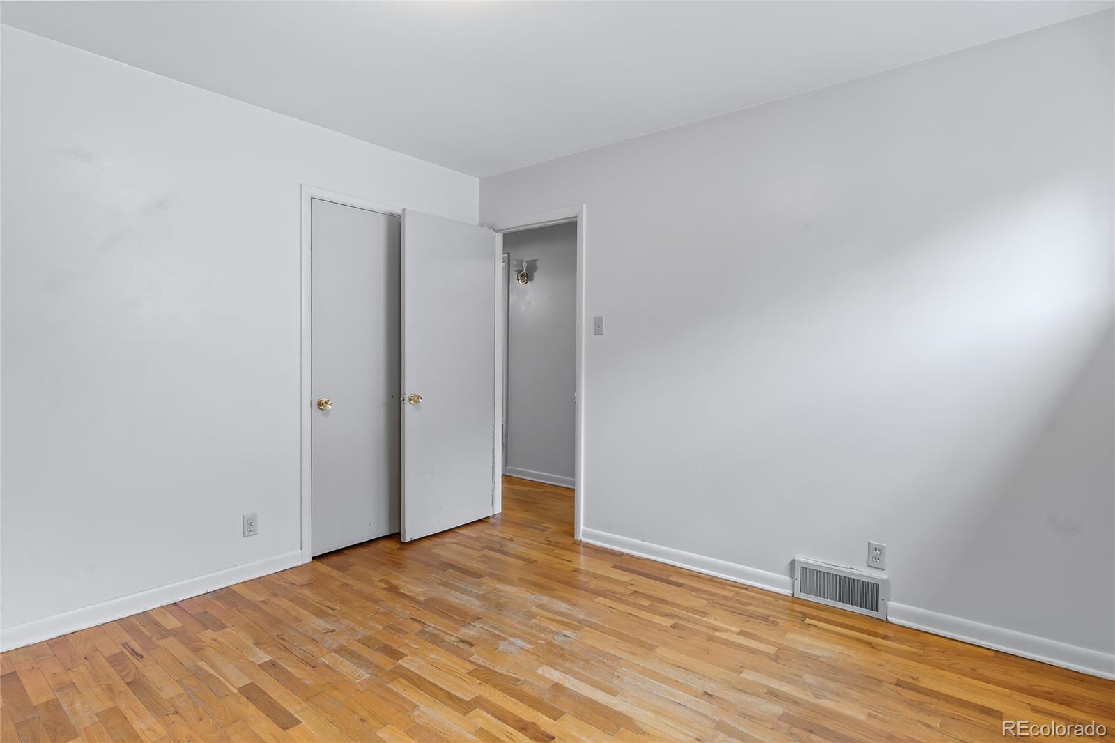 1971 Evergreen Avenue Boulder, CO 80304 - Photo 34 of 36 a view of an empty room with wooden floor