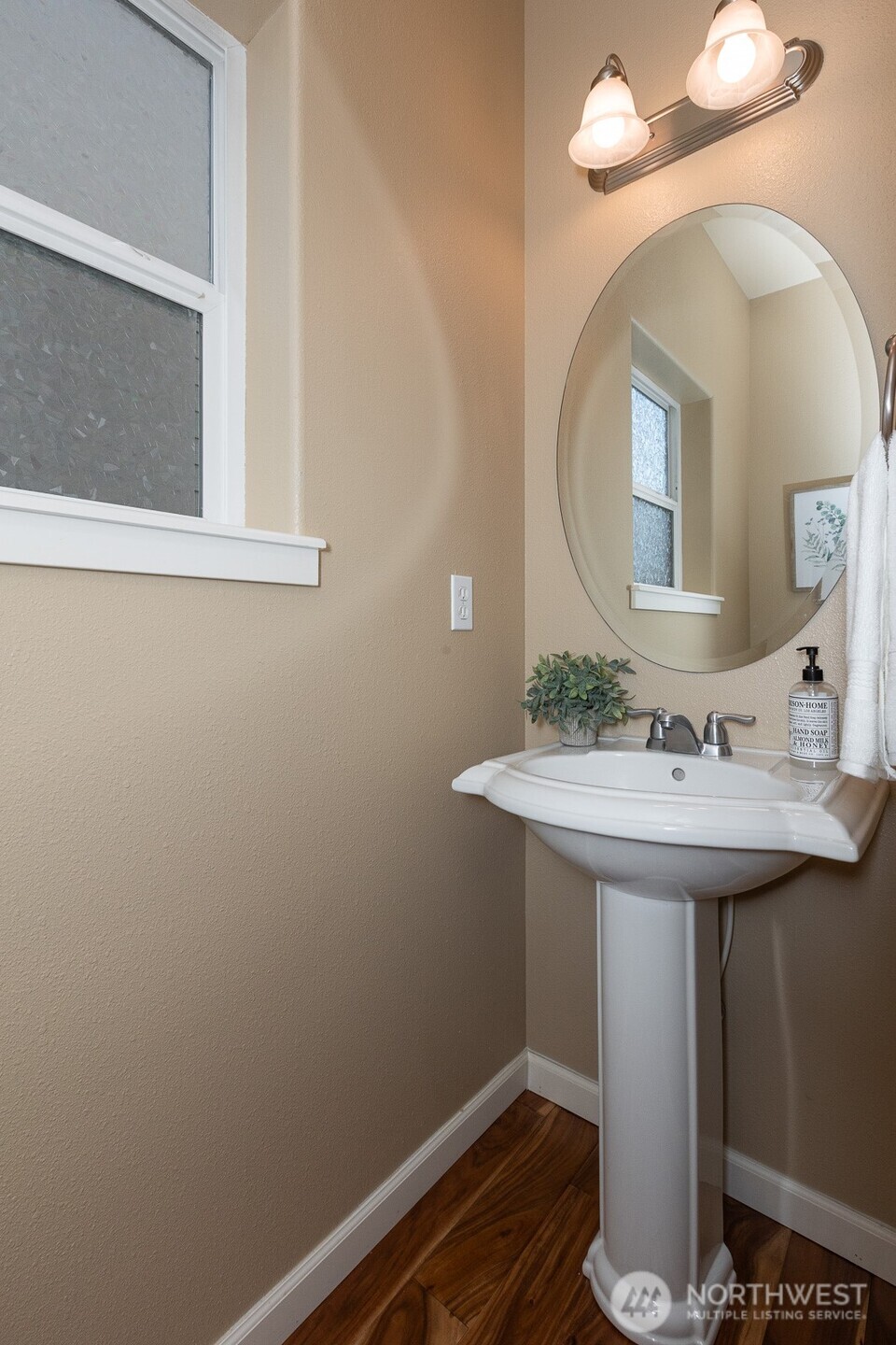 5002 70th Way Southeast Lacey, WA 98513 - Photo 11 of 40 a bathroom with a sink and a mirror