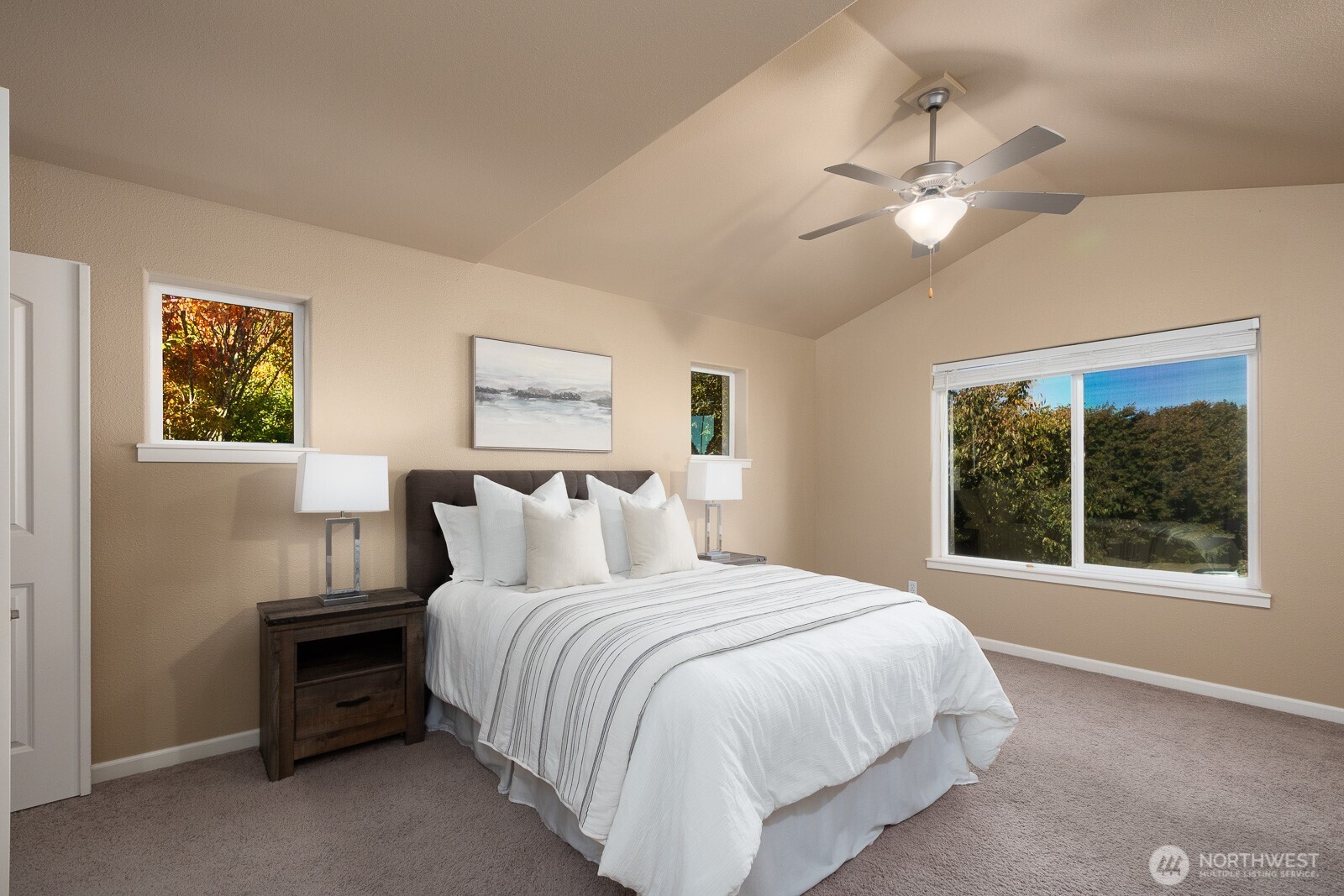 5002 70th Way Southeast Lacey, WA 98513 - Photo 16 of 40 a large bed sitting in a bedroom next to a window