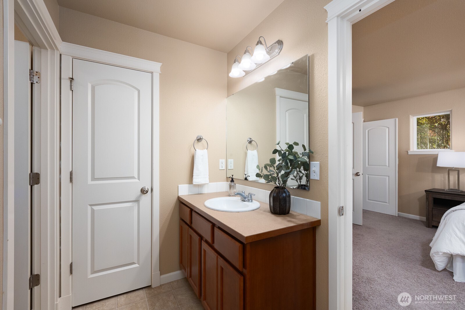 5002 70th Way Southeast Lacey, WA 98513 - Photo 19 of 40 a kitchen with a sink and cabinets