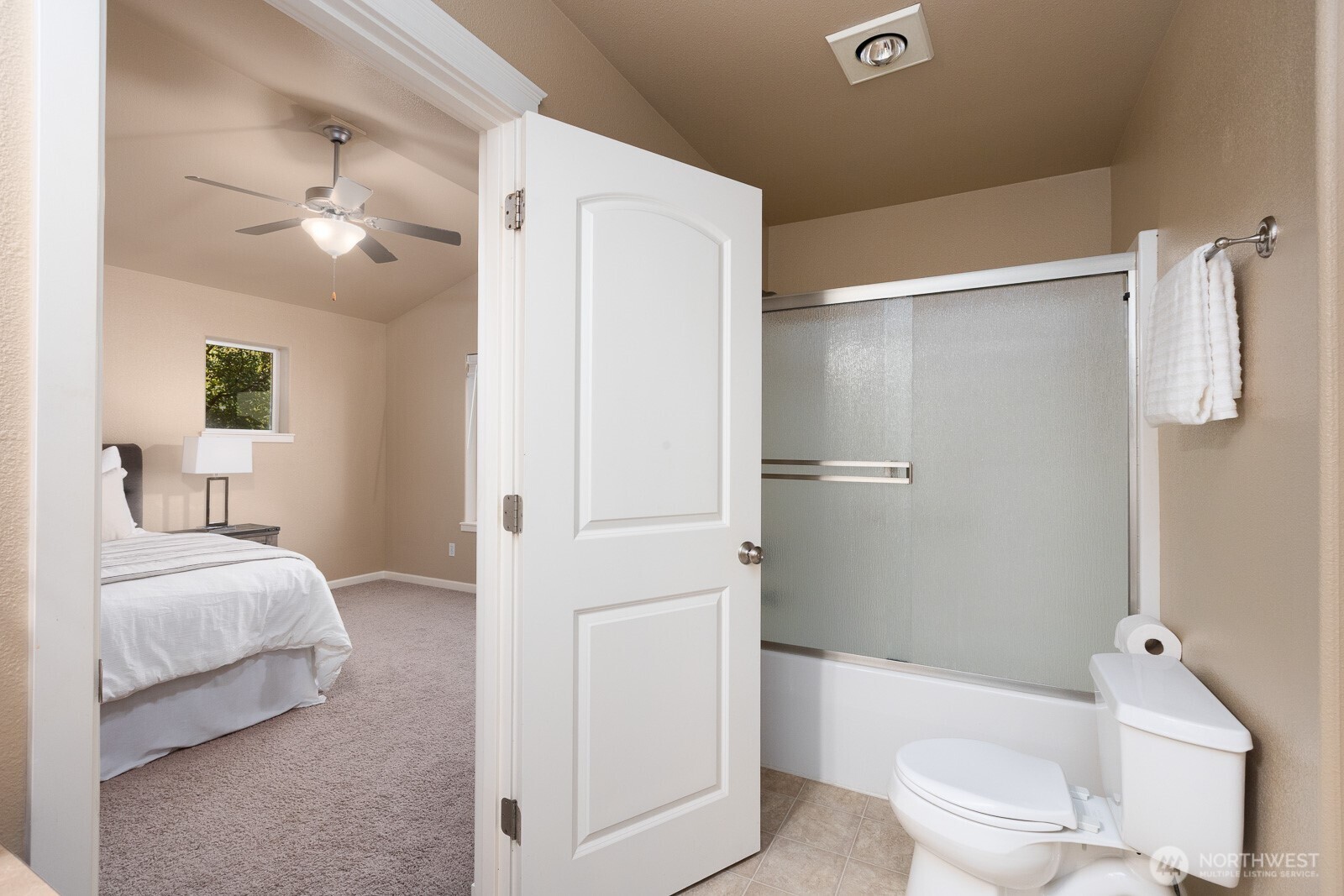 5002 70th Way Southeast Lacey, WA 98513 - Photo 20 of 40 a bathroom with a toilet and a shower