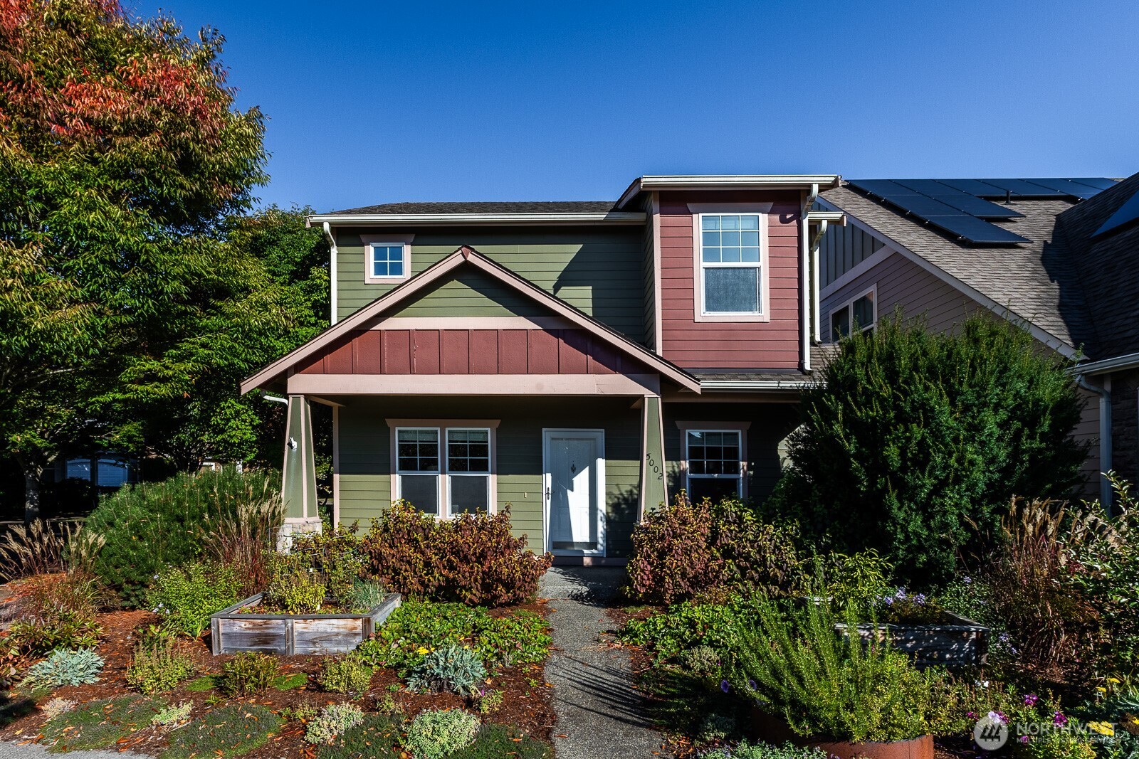 5002 70th Way Southeast Lacey, WA 98513 - Photo 2 of 40 a front view of a house with garden