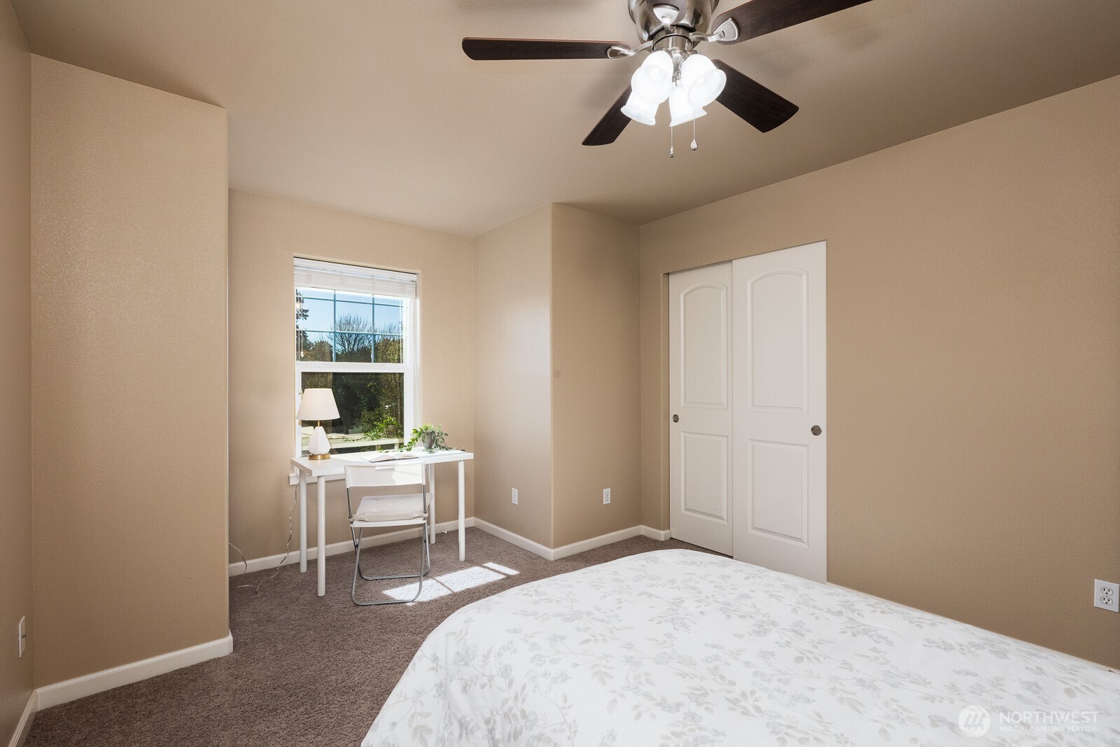 5002 70th Way Southeast Lacey, WA 98513 - Photo 24 of 40 a bedroom with a bed and a desk