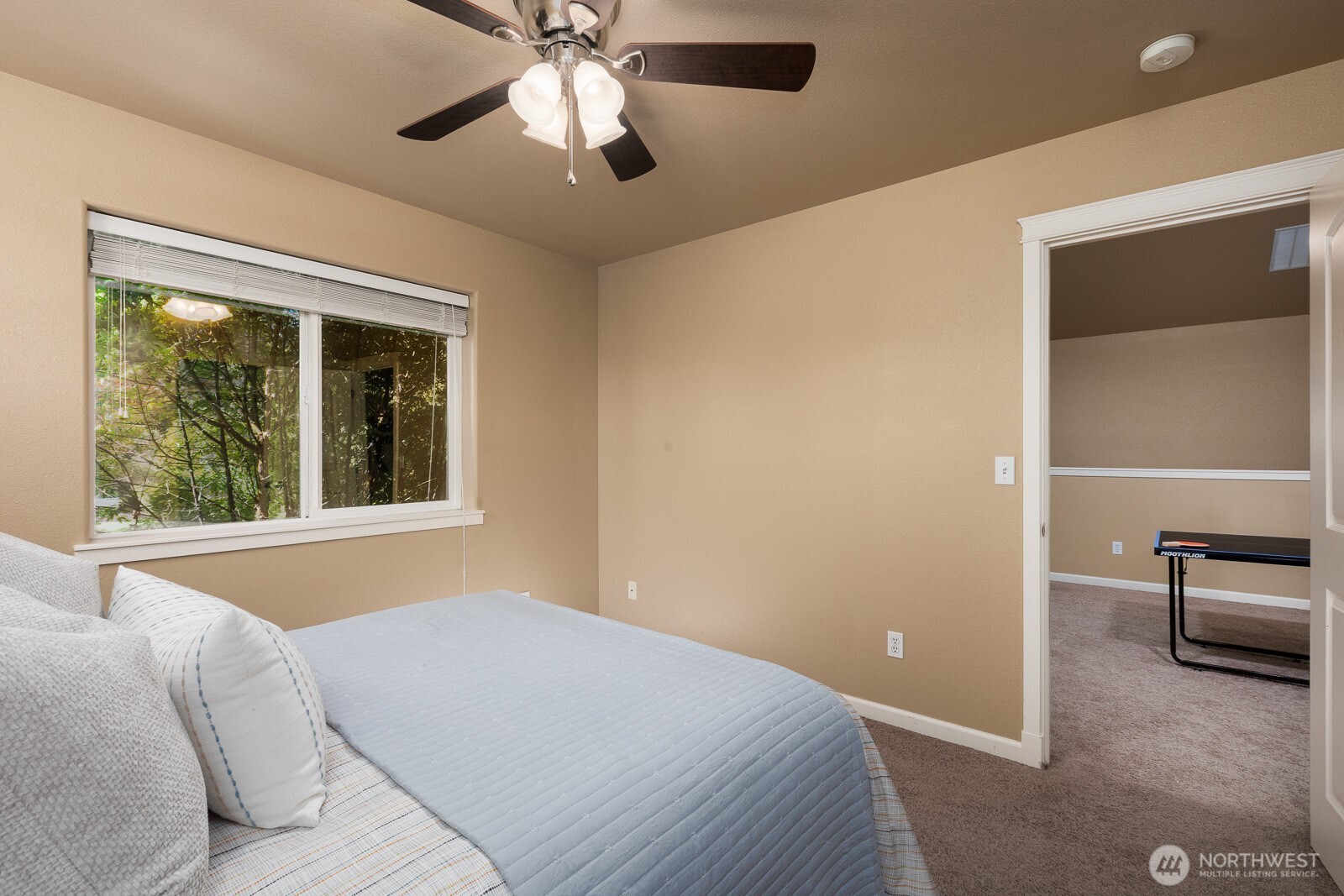 5002 70th Way Southeast Lacey, WA 98513 - Photo 27 of 40 a bedroom with a bed and a large window