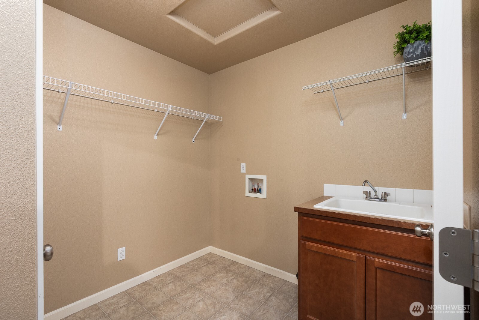 5002 70th Way Southeast Lacey, WA 98513 - Photo 29 of 40 a bathroom with a sink and vanity