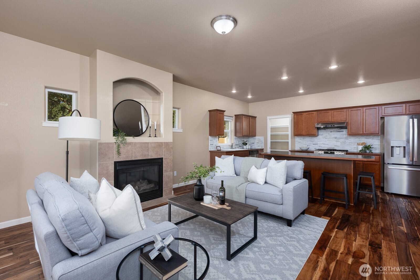 5002 70th Way Southeast Lacey, WA 98513 - Photo 3 of 40 a living room with furniture and a fireplace