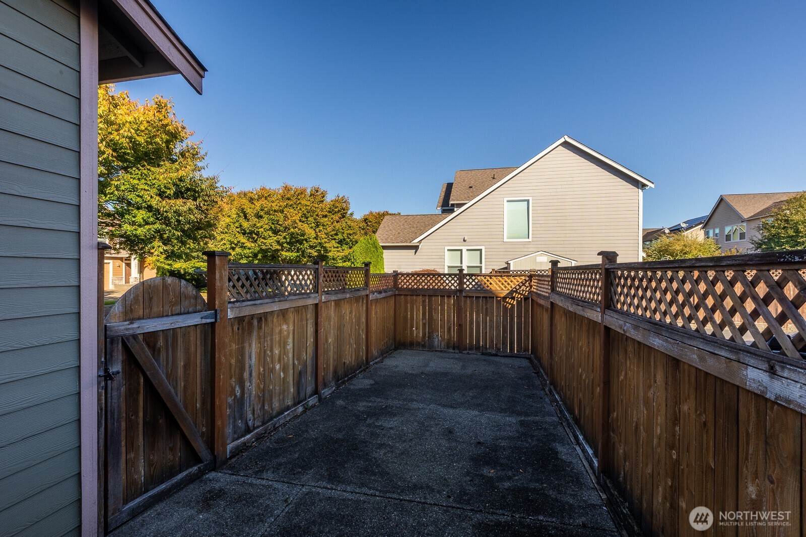 5002 70th Way Southeast Lacey, WA 98513 - Photo 33 of 40 a view of a pathway of a house with wooden fence