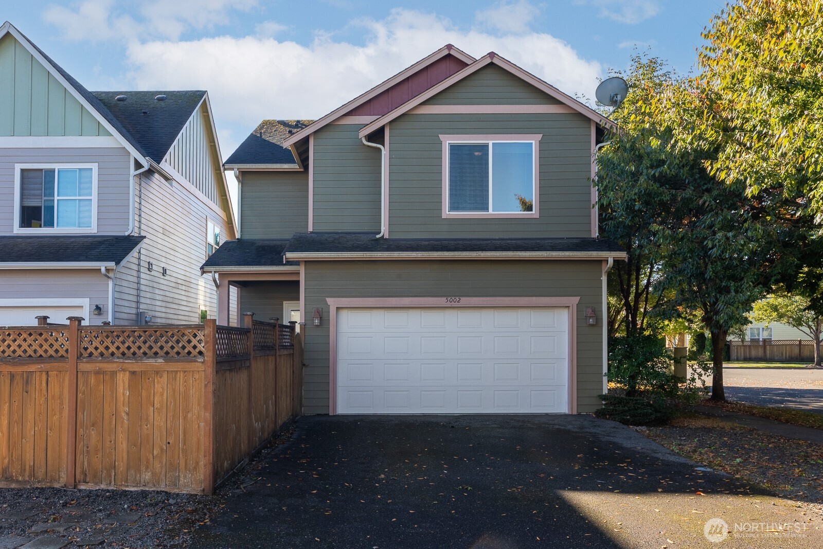 5002 70th Way Southeast Lacey, WA 98513 - Photo 36 of 40 a front view of a house with a yard and garage