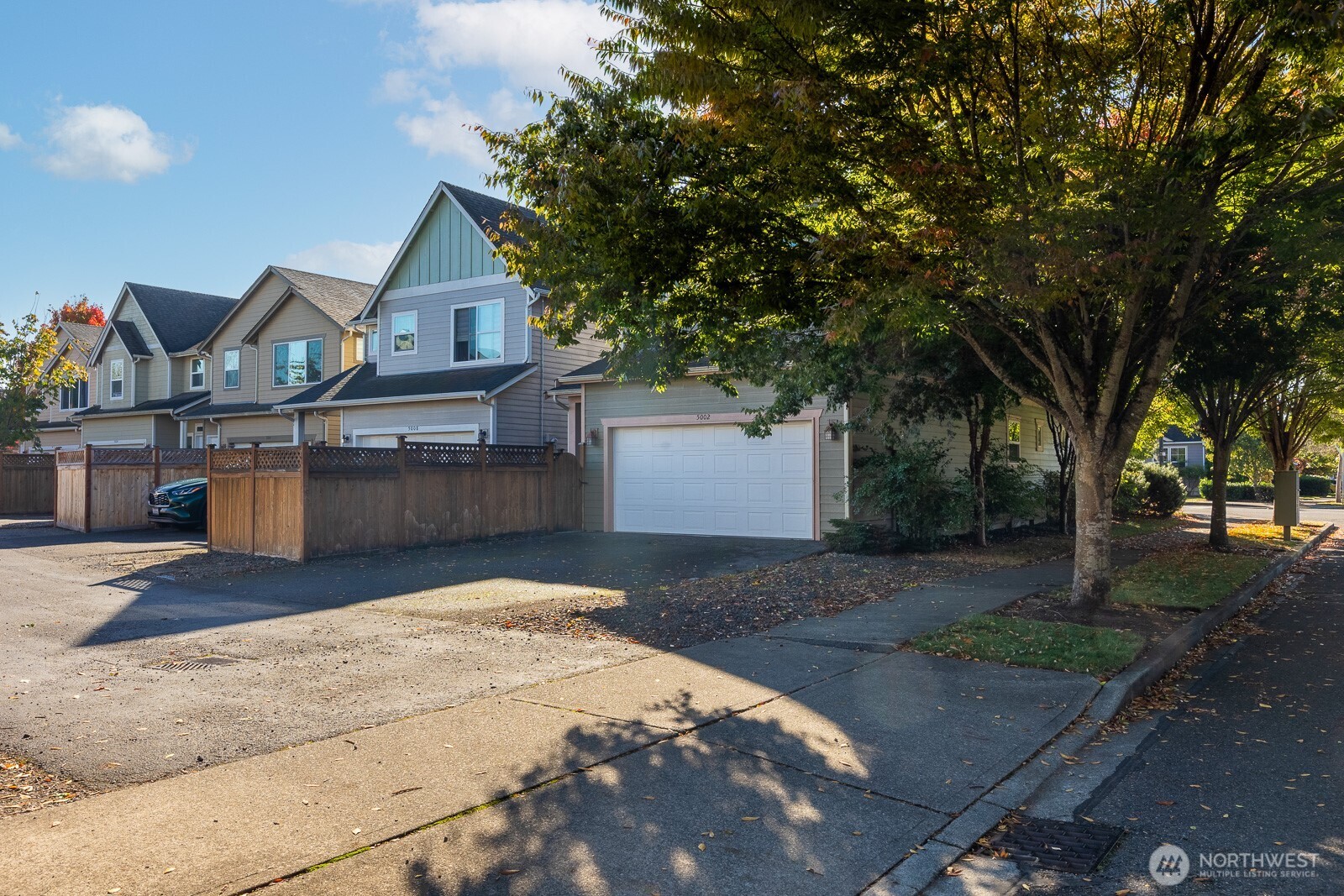 5002 70th Way Southeast Lacey, WA 98513 - Photo 37 of 40 a front view of a house with a yard and garage