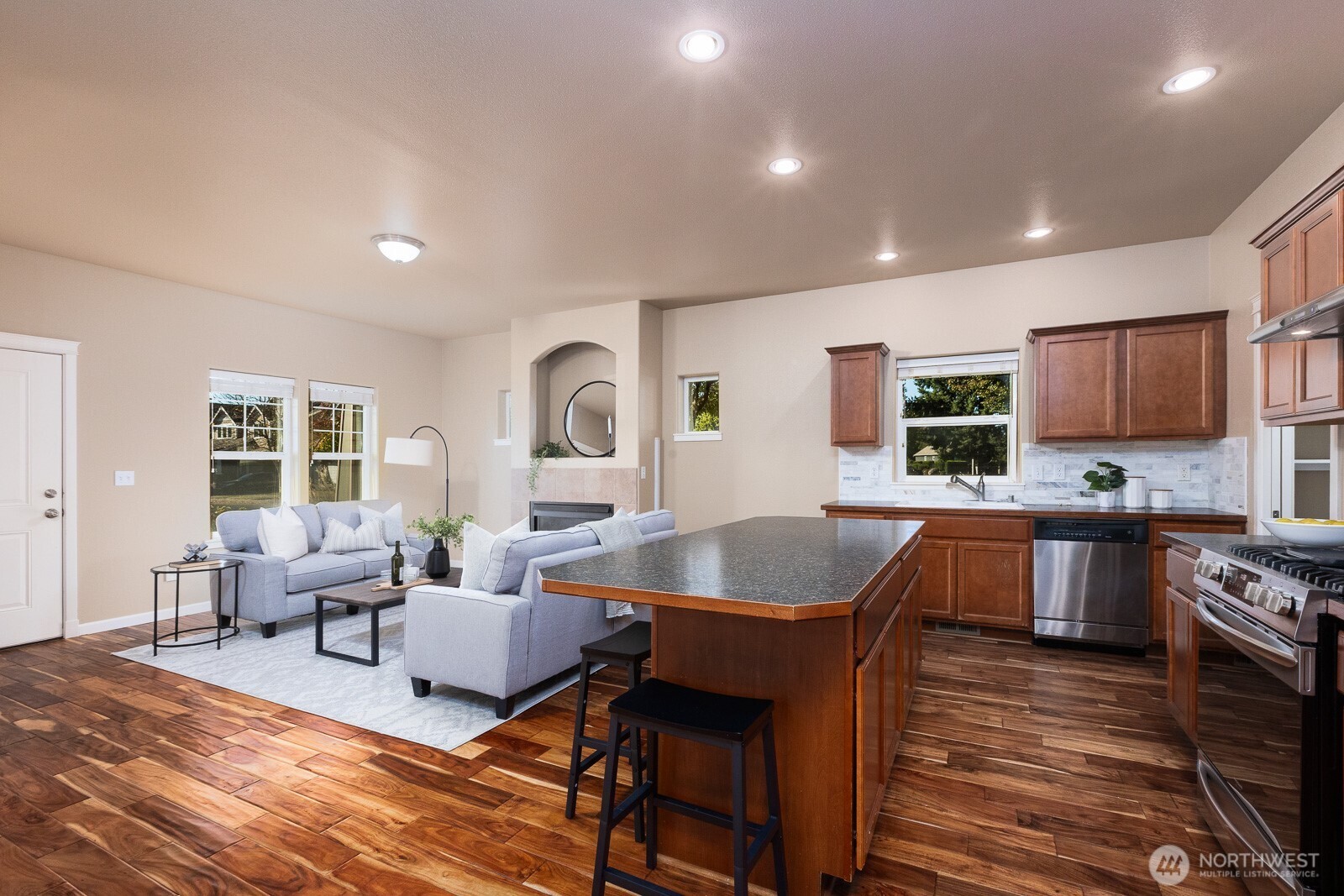 5002 70th Way Southeast Lacey, WA 98513 - Photo 5 of 40 a living room with furniture and a wooden floor