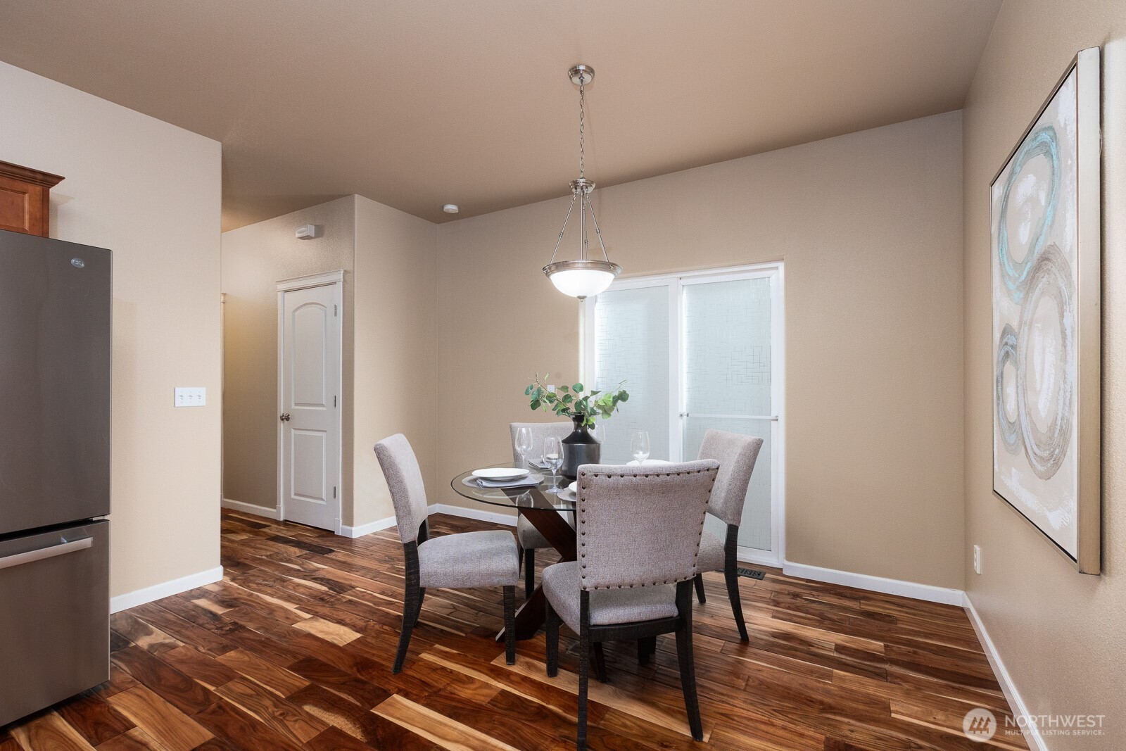 5002 70th Way Southeast Lacey, WA 98513 - Photo 8 of 40 a view of a dining room with furniture window and wooden floor
