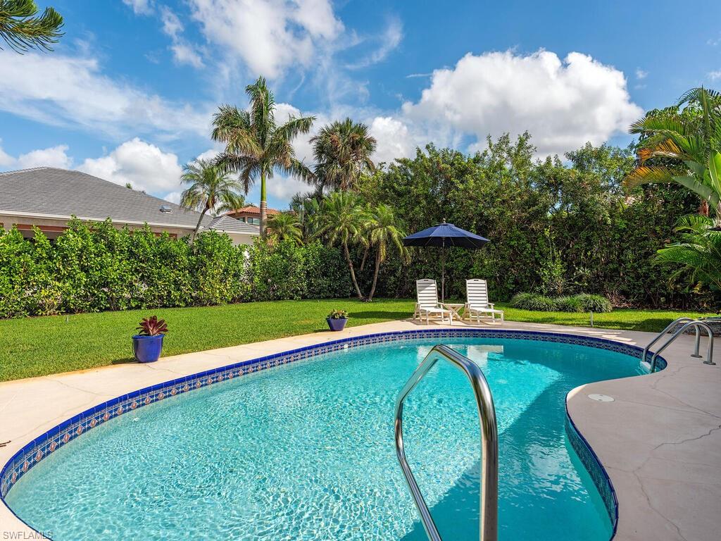 Outdoor pool with a yard