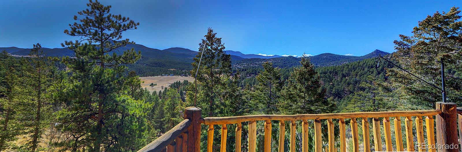 6561 Ridgeview Drive Morrison, CO 80465 - Photo 36 of 36 a view of a balcony with a forest