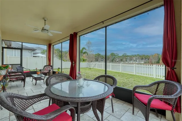 a balcony with furniture and a table